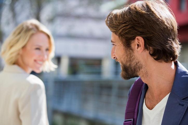 Two people smiling at each other